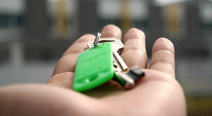 Parent Giving Car Key To Teen